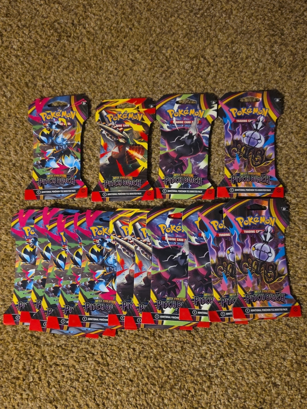 Pokemon Trading Card Booster Packs in Pink, Yellow, Blue, Black